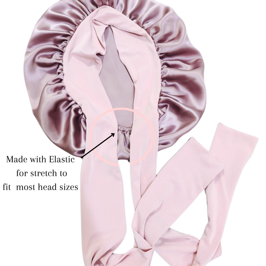 Shiny mauve mulberry silk bonnet with long, light pink stretchy ties for adjustable fit.