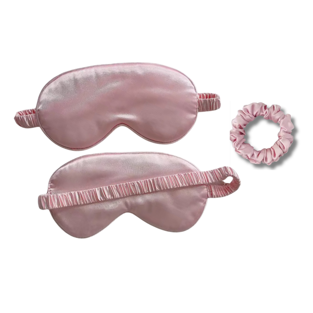 Pink mulberry silk sleep eye mask set with a matching scrunchie.