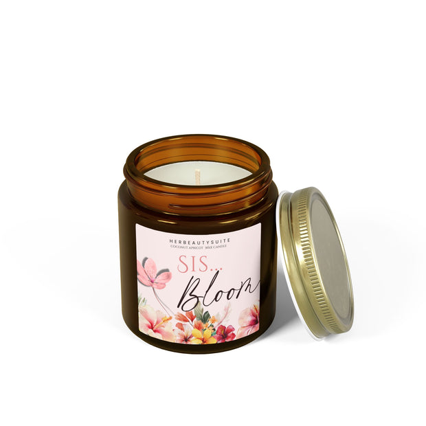 4oz amber glass "Bloom Sis" candle with a pink floral label and gold lid.