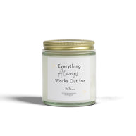 White soy candle in a clear glass jar with a gold lid, featuring 