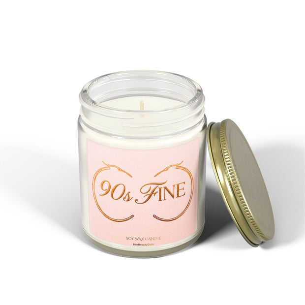 4oz clear glass "90s Fine" affirmation candle with a pink label featuring gold hoops and a gold lid.
