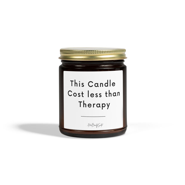 4oz amber glass candle with gold lid, "This Candle Cost less than Therapy" label.