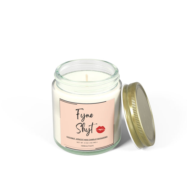 Clear glass 9oz "Fyne Shyt" self-love affirmation candle with a gold lid, coconut-apricot wax.