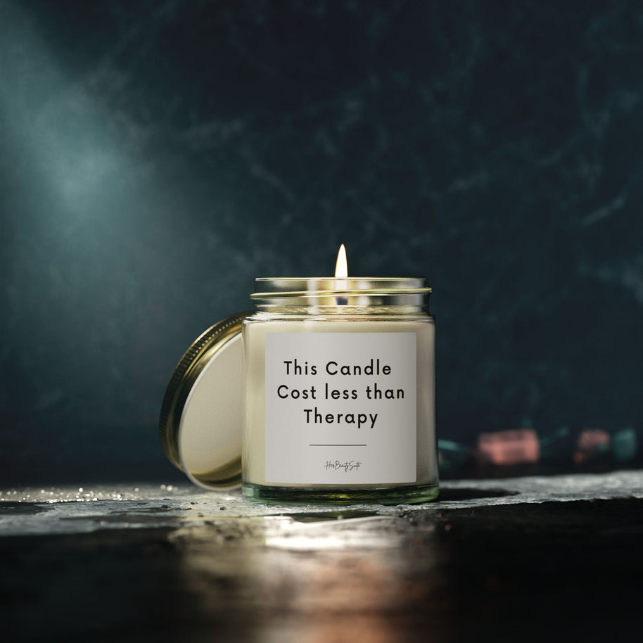 Lit clear glass candle with gold lid, 