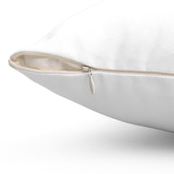 Close-up of a white polyester throw pillow with a concealed beige zipper.
