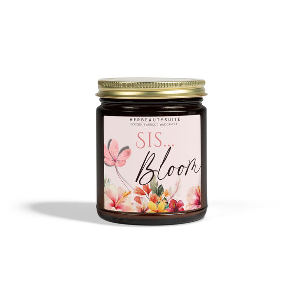 9oz Bloom Sis self-love manifestation candle in an amber glass vessel with a gold lid and floral label.