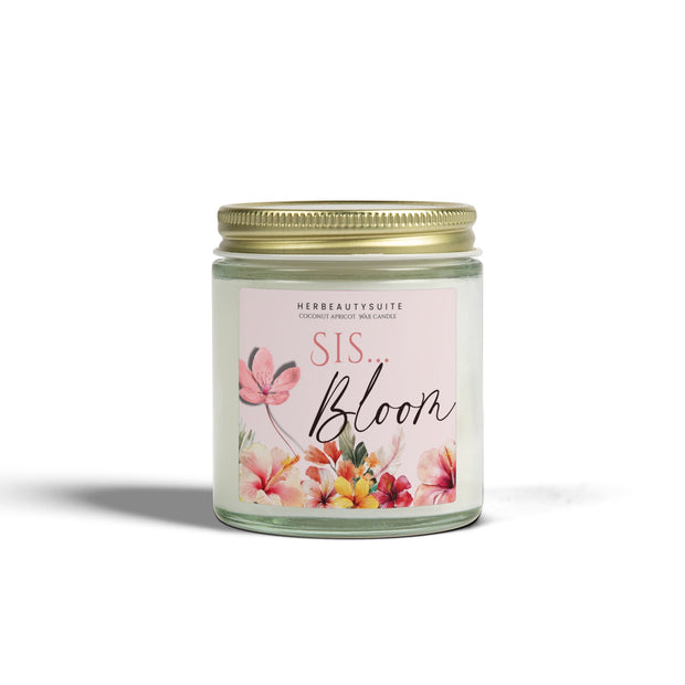 4oz "Bloom Sis" self-love manifestation candle in a clear glass jar with a gold lid and floral label.