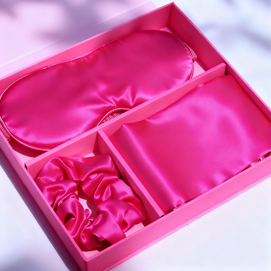 Hot pink luxury satin 3 pc pillowcase set with eye mask and hair scrunchie in a gift box.