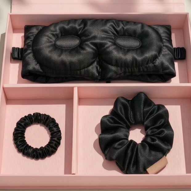 Black mulberry silk 3D sleep mask and two matching scrunchies in a pink luxury gift box.
