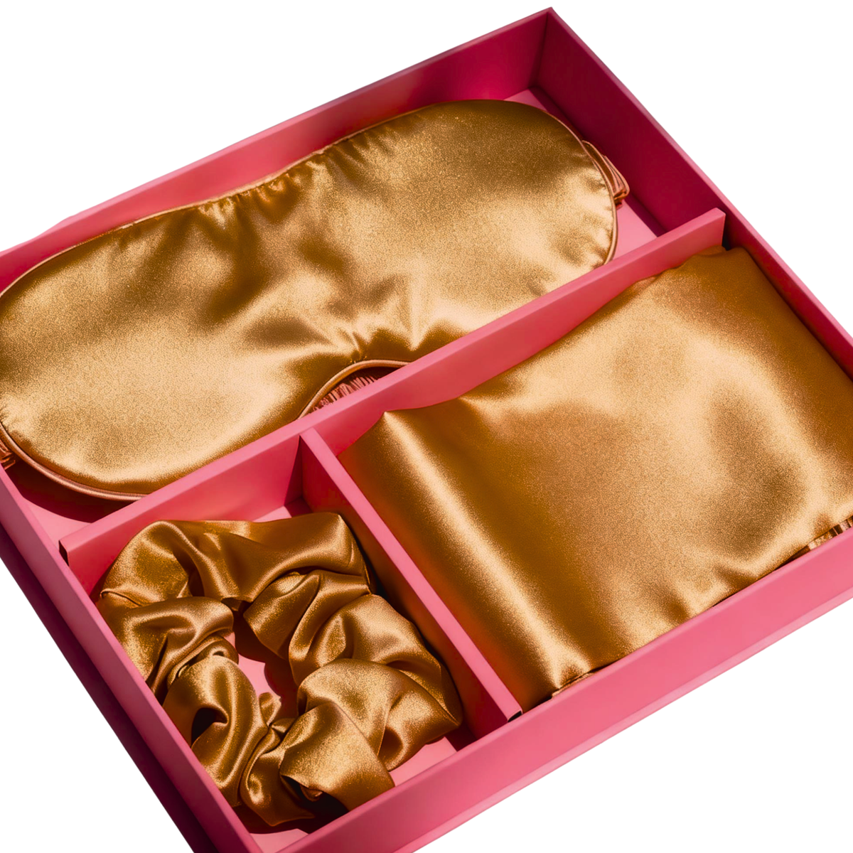Luxury Dark Gold satin pillowcase, eye mask, and scrunchie gift set in a pink box.