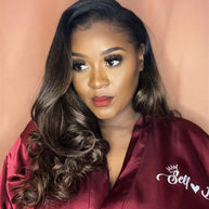 Woman wearing a custom burgundy satin robe with 